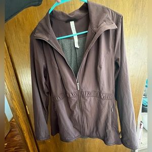 Lulu lemon zip up jacket. Size 12. Plum colored in excellent condition.